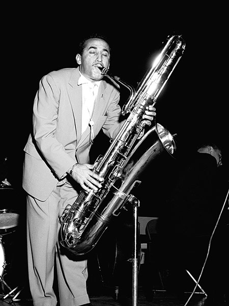 Photo: Charlie Ventura playing saxophone. Photo by Carl Henniger.