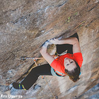 photo Maureen Beck climbing rock face