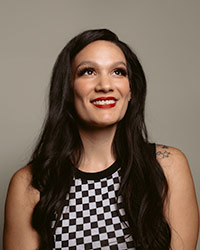 Publicity headshot photo of Adrianne Chalepah smiling