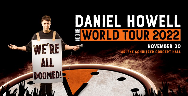 Photo of Daniel Howell wearing a sign that says We're All Doomed | AEG Presents DANIEL HOWELL: WE’RE ALL DOOMED! Wednesday, November 30, 2022, 7:30pm Playing at: Arlene Schnitzer Concert Hall
