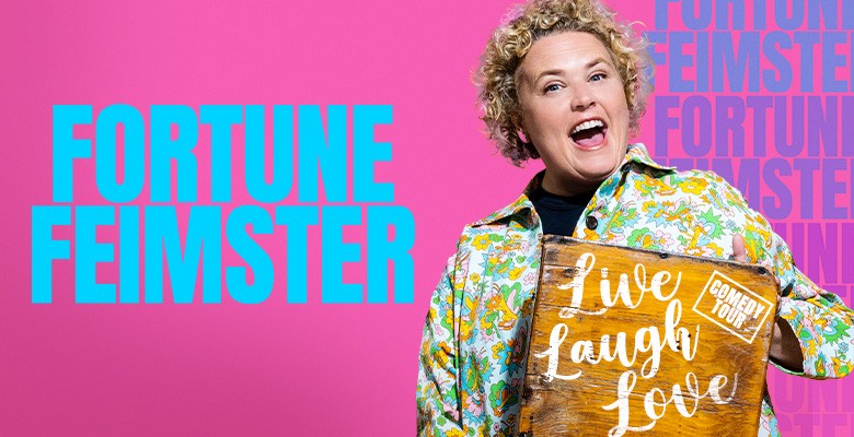 Photo of Fortune Feimster laughing, holding bag with text on it: Live Laugh Love and "Fortune Feimster" in bold text on the left side of image 