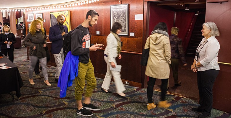 A Portland'5 Volunteer ushering at a "Hands Up" performance  (2017)