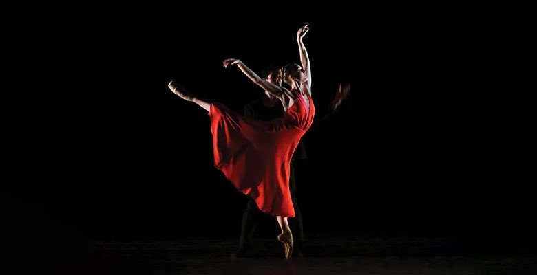 Dancer wearing red dress in pose