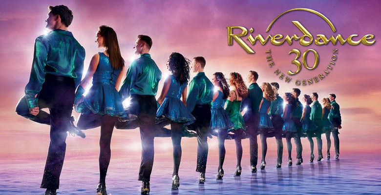 Photo of a line of Irish dancers fading into the distance. Included in the Riverdance 30 logo.