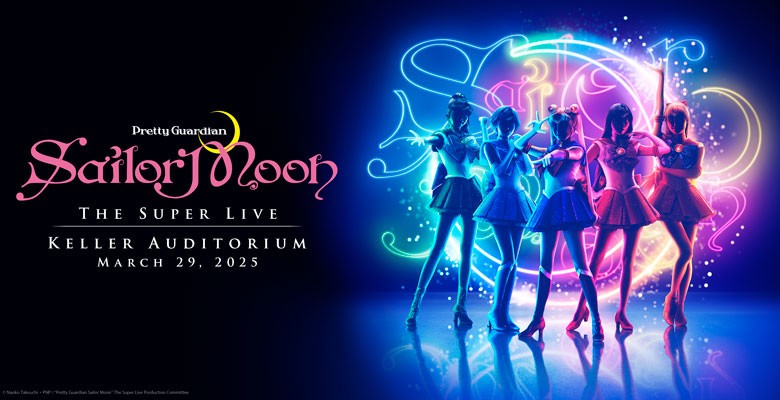 Sailor Moon and the Sailor Guardians pose on stage with exciting lights