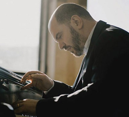 Photo of Kirill Gerstein playing piano