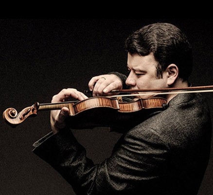 Photo of Vadium Gluzman playing violin.