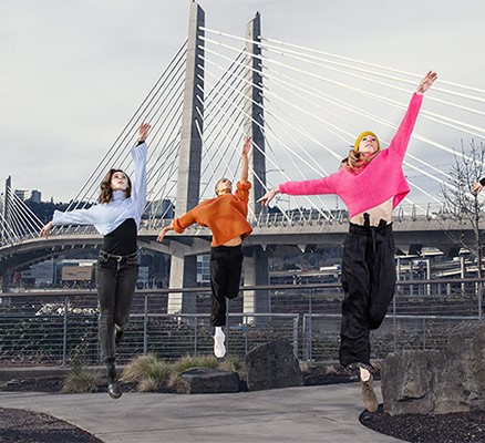 Photo of OBT dancers in action with Tillicum Crossing bridge in background