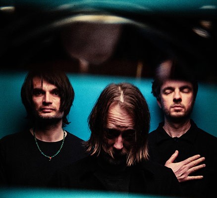 Photo of The Smile members (l-r): Jonny Greenwood, Thom Yorke, Tom Skinner