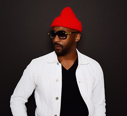 Photo of Redray Frazier wearing a red winter hat and sunglasses