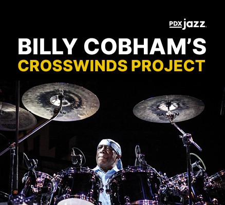 Photo of Billy Cobham sitting behind and playing drums