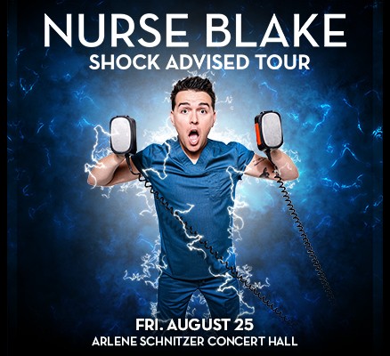 Nurse Blake: Shock Advised Tour image of Nurse Blake holding defibrillator