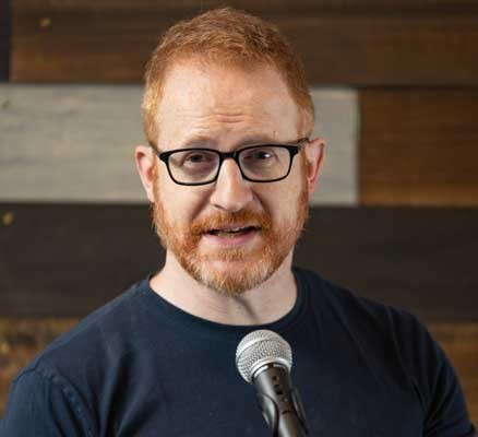 Photo of Steve Hofstetter standing in front of microphone