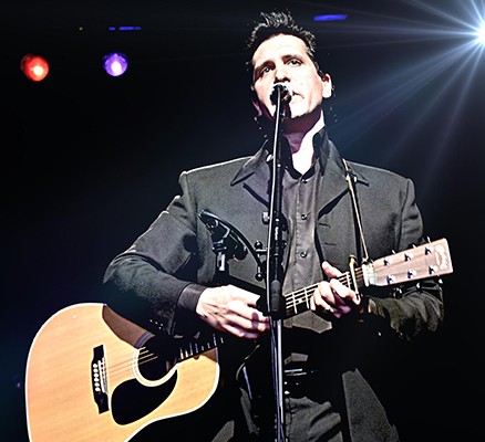 Photo of James Garner holding guitar, performing as Johnny Cash