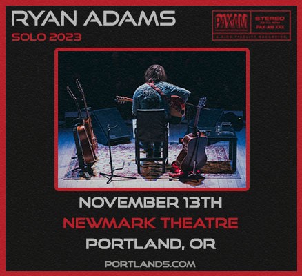 Photo of Ryan Adams from behind, sitting playing guitar + info text