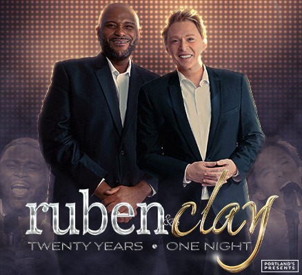 Photo of Ruben Studdard and Clay Aiken standing side-by-side