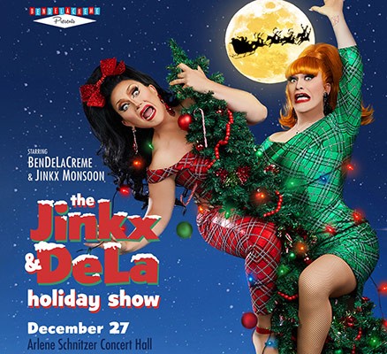 Image of Jinkx & DeLa straddling a Christmas tree + stylized title text