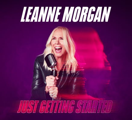 Photo of Leanne Morgan laughing, holding microphone with name & tour name text