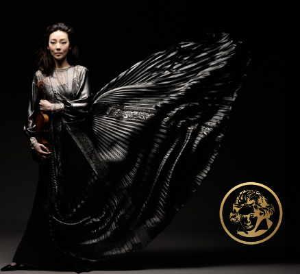 clara-jumi kang holding violin in black dress flowing to side