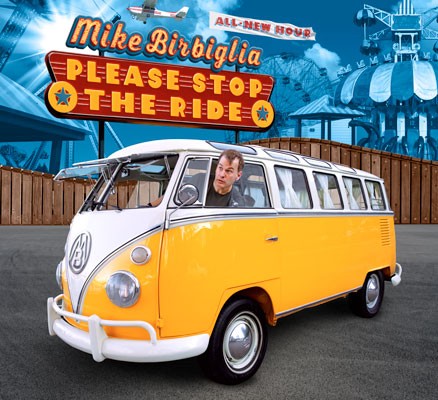 Image of Mike leaning head out of a VW bus with carnival rides in background