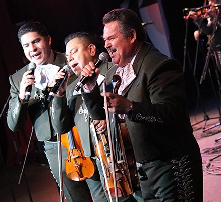 Photo of Jesus Guzman and two other members of Mariachi Los Camperos performing