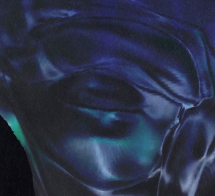 black and blue image of bottom half of face covered in cloth