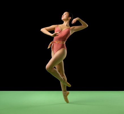 Photo of a dancer posing on an empty stage
