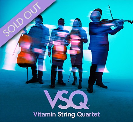 Blurry photo of Vitamin String Quartet musicians with instruments