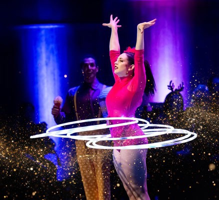 Image of female Troupe Vertigo with rings around her waist.
