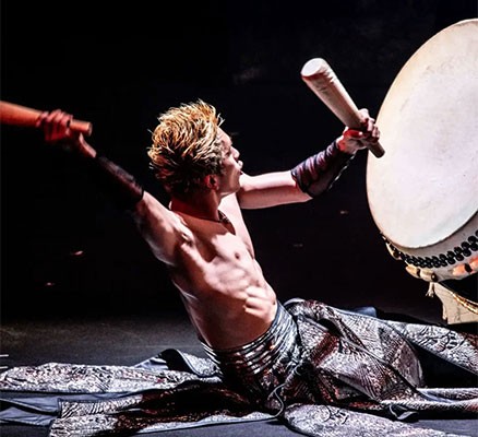 Photo of Drum Tao percussionist playing large drum