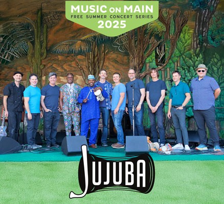Jujuba band members standing on stage with Music on Main logo at top.