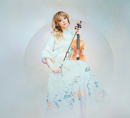 Photo of Lindsey Stirling holding violin