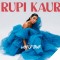 Photo of Rupi Kaur wearing blue dress | Text: Rupi Kaur World Tour
