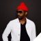 Photo of Redray Frazier wearing a red winter hat and sunglasses