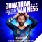 Photo of Jonathan Van Ness wearing a blue gymnist unitard with USA letters on it