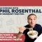 Photo of Phil Rosenthal eating ramen with chop sticks from a bowl he is holding