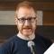 Photo of Steve Hofstetter standing in front of microphone