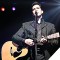 Photo of James Garner holding guitar, performing as Johnny Cash