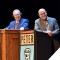 Photo of Bill and Peter from Wait Wait Don't Tell Me standing behind podiums