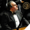 yefim bronfman in tuxedo at piano playing and looking to right
