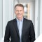 image of steve inskeep wearing black suit jacket and blue dress shirt