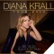 Photo o Diana Krall sitting at piano with name and tour info in text