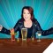 Photo of Kathleen Madigan standing at table with drinks on it