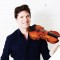 Photo of Joshua Bell holding violin on his shoulder